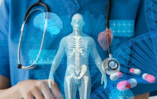 Woman in medical gear appearing to hold a hologram of a human body.