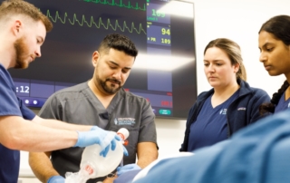 KansasCOM students do medicine in a medicine setting.