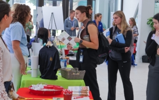 two women at a college information fare.