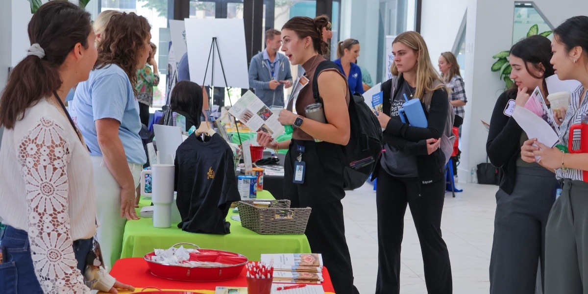 two women at a college information fare.