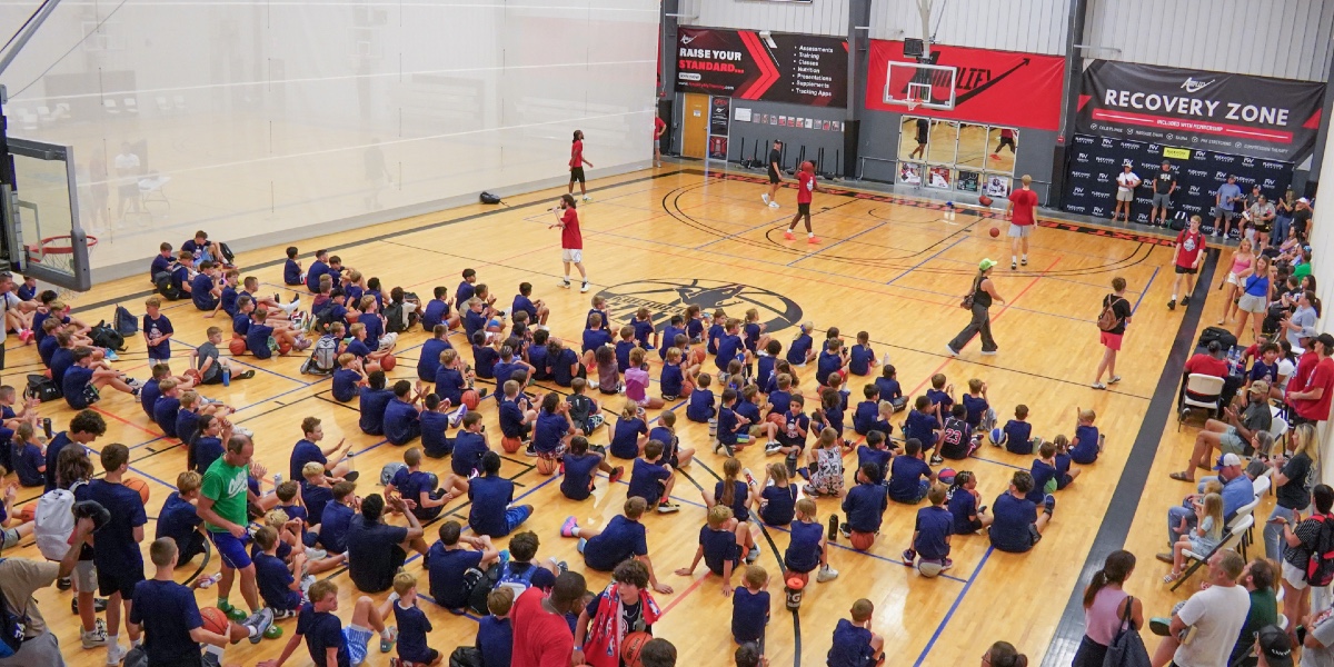 Campers crowd the court as the dunk contest brings an energetic finish to the day.
